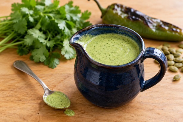 Creamy green cilantro dressing in a small bowl